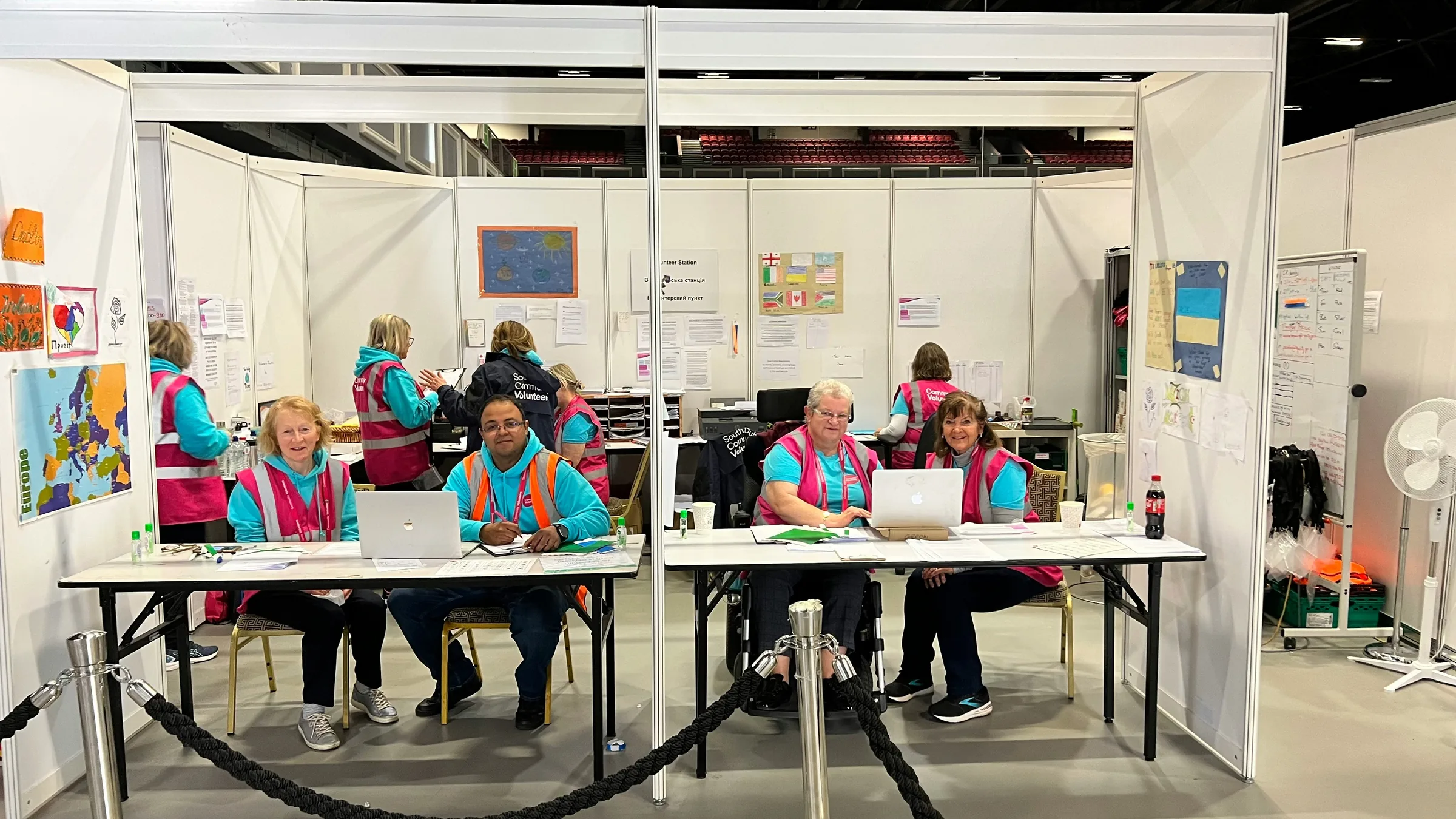 Event staff working the registration desk at an exhibition
